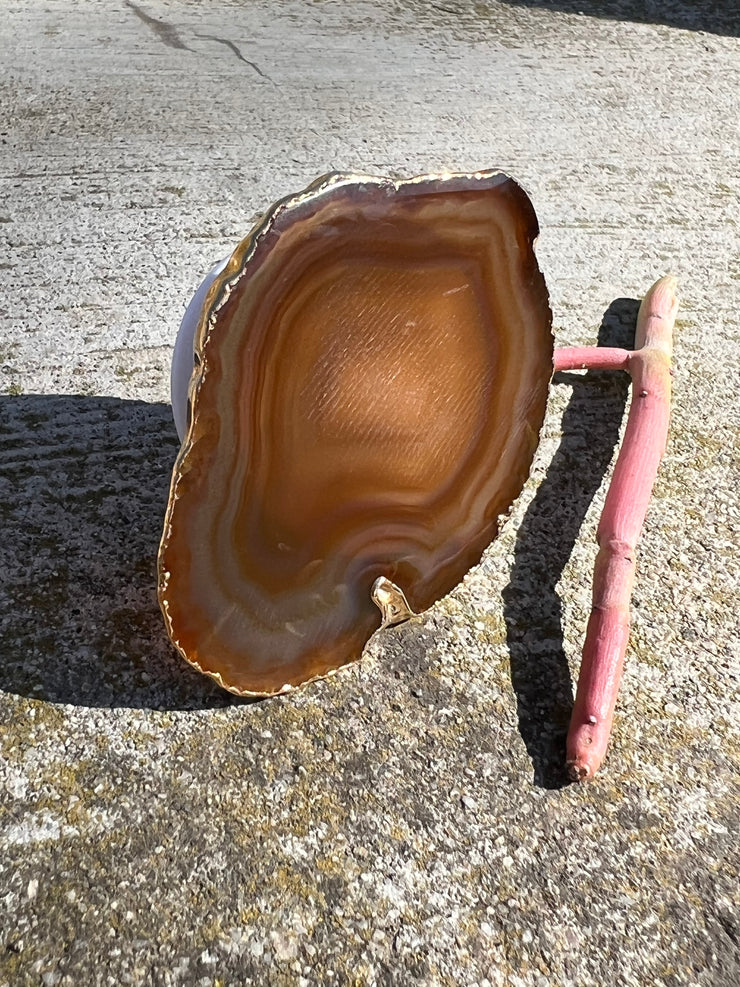 Brown Agate pop socket (popsocket) for use with iphone, androids, ipads, smartphones, and other small tecnical devices. Used for easy grip of electronics as well as a beautiful phone accessory. It is an attachment that easily tapes onto the back of the device and pops in and out as needed for use. These agate slices are natural and pure agate stones imported from Brazil of the highest quality and beautifylly gold dipped on the rim.