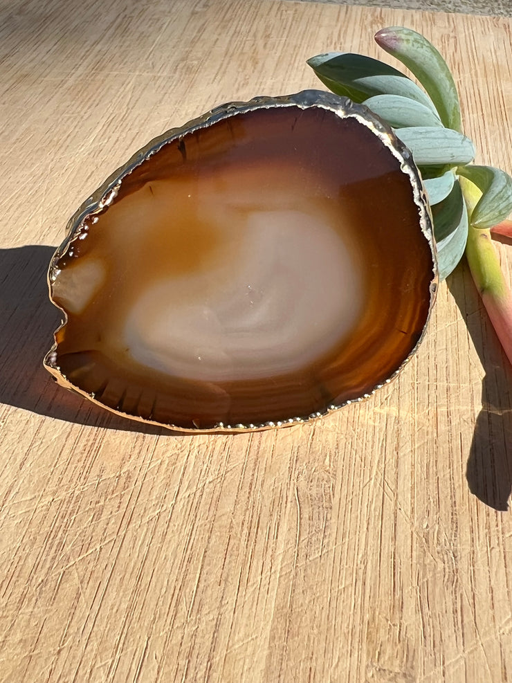 Brown Agate pop socket (popsocket) for use with iphone, androids, ipads, smartphones, and other small tecnical devices. Used for easy grip of electronics as well as a beautiful phone accessory. It is an attachment that easily tapes onto the back of the device and pops in and out as needed for use. These agate slices are natural and pure agate stones imported from Brazil of the highest quality and beautifylly gold dipped on the rim.