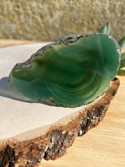 Green Agate pop socket (popsocket) for use with iphone, androids, ipads, smartphones and other small tecnical devices. Used for easy grip of electronics as well as a beautiful phone accessory. It is an attachment that easily tapes onto the back of the device and pops in and out as needed for use. These agate slices are natural and pure agate stones imported from Brazil of the highest quality with it's natural edges exposed.