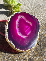 Pink Agate pop socket (popsocket) for use with iphone, androids, ipads, smartphones and other small tecnical devices. Used for easy grip of electronics as well as a beautiful phone accessory. It is an attachment that easily tapes onto the back of the device and pops in and out as needed for use. These agate slices are natural and pure agate stones imported from Brazil of the highest quality and beautifylly gold dipped on the rim.