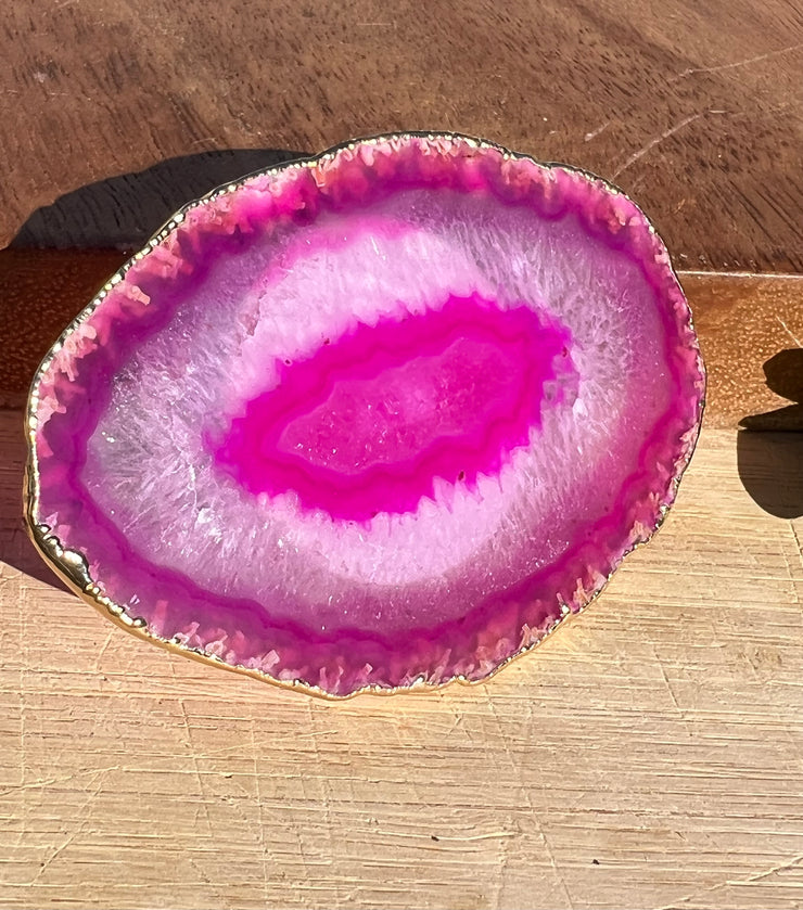 Pink Agate pop socket (popsocket) for use with iphone, androids, ipads, smartphones and other small tecnical devices. Used for easy grip of electronics as well as a beautiful phone accessory. It is an attachment that easily tapes onto the back of the device and pops in and out as needed for use. These agate slices are natural and pure agate stones imported from Brazil of the highest quality and beautifylly gold dipped on the rim.
