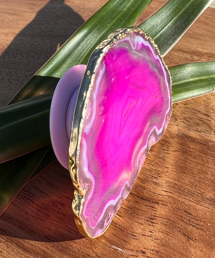 Pink Agate pop socket (popsocket) for use with iphone, androids, ipads, smartphones and other small tecnical devices. Used for easy grip of electronics as well as a beautiful phone accessory. It is an attachment that easily tapes onto the back of the device and pops in and out as needed for use. These agate slices are natural and pure agate stones imported from Brazil of the highest quality and beautifylly gold dipped on the rim.