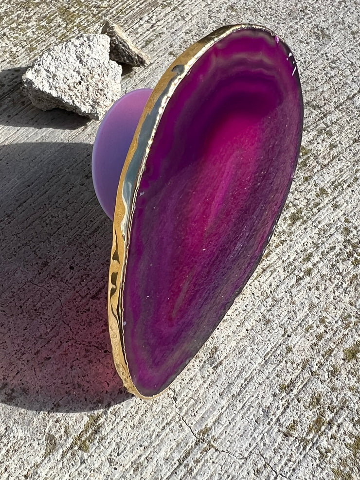 Pink Agate pop socket (popsocket) for use with iphone, androids, ipads, smartphones and other small tecnical devices. Used for easy grip of electronics as well as a beautiful phone accessory. It is an attachment that easily tapes onto the back of the device and pops in and out as needed for use. These agate slices are natural and pure agate stones imported from Brazil of the highest quality and beautifylly gold dipped on the rim.