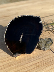 Black Agate pop socket (popsocket) for use with iphone, androids, ipads, and other small tecnical devices. Used for easy grip of electronics as well as a beautiful phone accessory. It is an attachment that easily tapes onto the back of the device and pops in and out as needed for use. These agate slices are natural and pure agate stones imported from Brazil of the highest quality and beautifylly gold dipped on the rim.