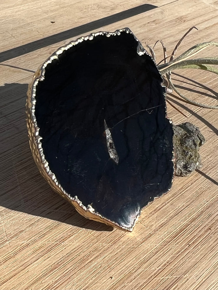 Black Agate pop socket (popsocket) for use with iphone, androids, ipads, and other small tecnical devices. Used for easy grip of electronics as well as a beautiful phone accessory. It is an attachment that easily tapes onto the back of the device and pops in and out as needed for use. These agate slices are natural and pure agate stones imported from Brazil of the highest quality and beautifylly gold dipped on the rim.