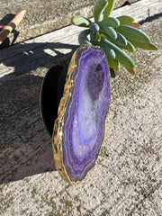 Purple Agate pop socket (popsocket) for use with iphone, androids, ipads, smartphones and other small tecnical devices. Used for easy grip of electronics as well as a beautiful phone accessory. It is an attachment that easily tapes onto the back of the device and pops in and out as needed for use. These agate slices are natural and pure agate stones imported from Brazil of the highest quality and beautifylly gold dipped on the rim.