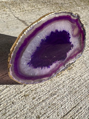 Purple Agate pop socket (popsocket) for use with iphone, androids, ipads, smartphones and other small tecnical devices. Used for easy grip of electronics as well as a beautiful phone accessory. It is an attachment that easily tapes onto the back of the device and pops in and out as needed for use. These agate slices are natural and pure agate stones imported from Brazil of the highest quality and beautifylly gold dipped on the rim.