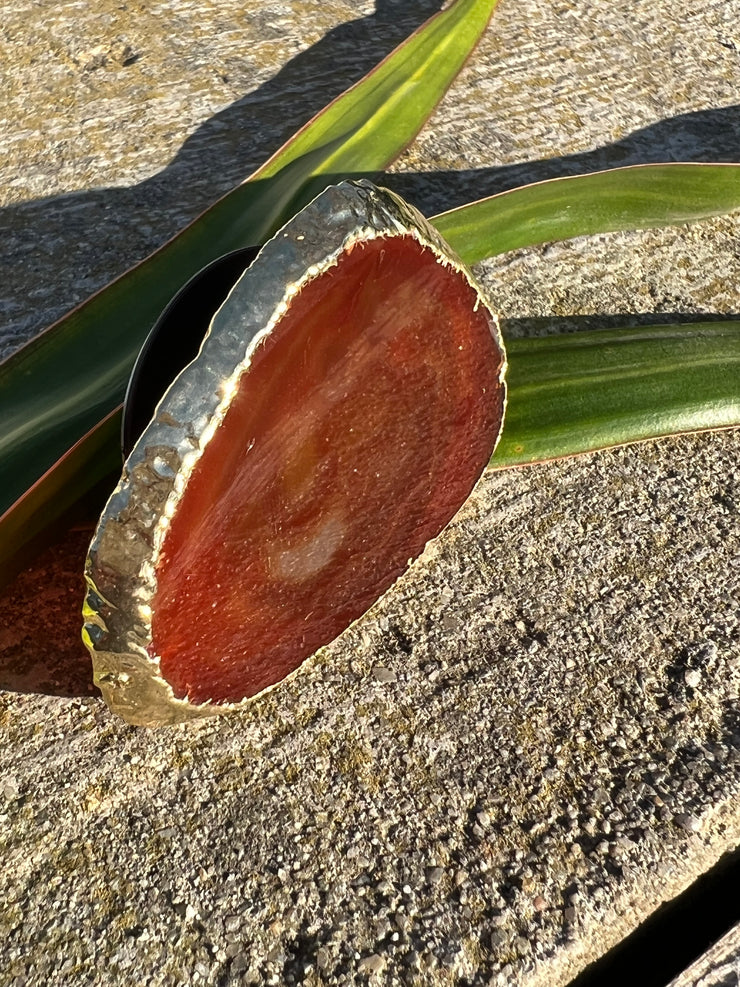 Red Agate pop socket (popsocket) for use with iphone, androids, ipads, smartphones and other small tecnical devices. Used for easy grip of electronics as well as a beautiful phone accessory. It is an attachment that easily tapes onto the back of the device and pops in and out as needed for use. These agate slices are natural and pure agate stones imported from Brazil of the highest quality and beautifylly gold dipped on the rim.
