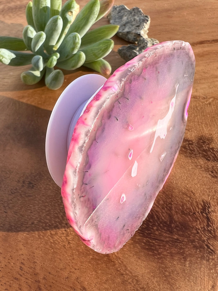 Pink Agate pop socket (popsocket) for use with iphone, androids, ipads, smartphones and other small tecnical devices. Used for easy grip of electronics as well as a beautiful phone accessory. It is an attachment that easily tapes onto the back of the device and pops in and out as needed for use. These agate slices are natural and pure agate stones imported from Brazil of the highest quality with it&