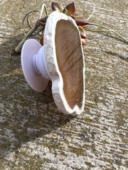 Brown Agate pop socket (popsocket) for use with iphone, androids, ipads, smartphones and other small tecnical devices. Used for easy grip of electronics as well as a beautiful phone accessory. It is an attachment that easily tapes onto the back of the device and pops in and out as needed for use. These agate slices are natural and pure agate stones imported from Brazil of the highest quality with it's natural edges exposed.