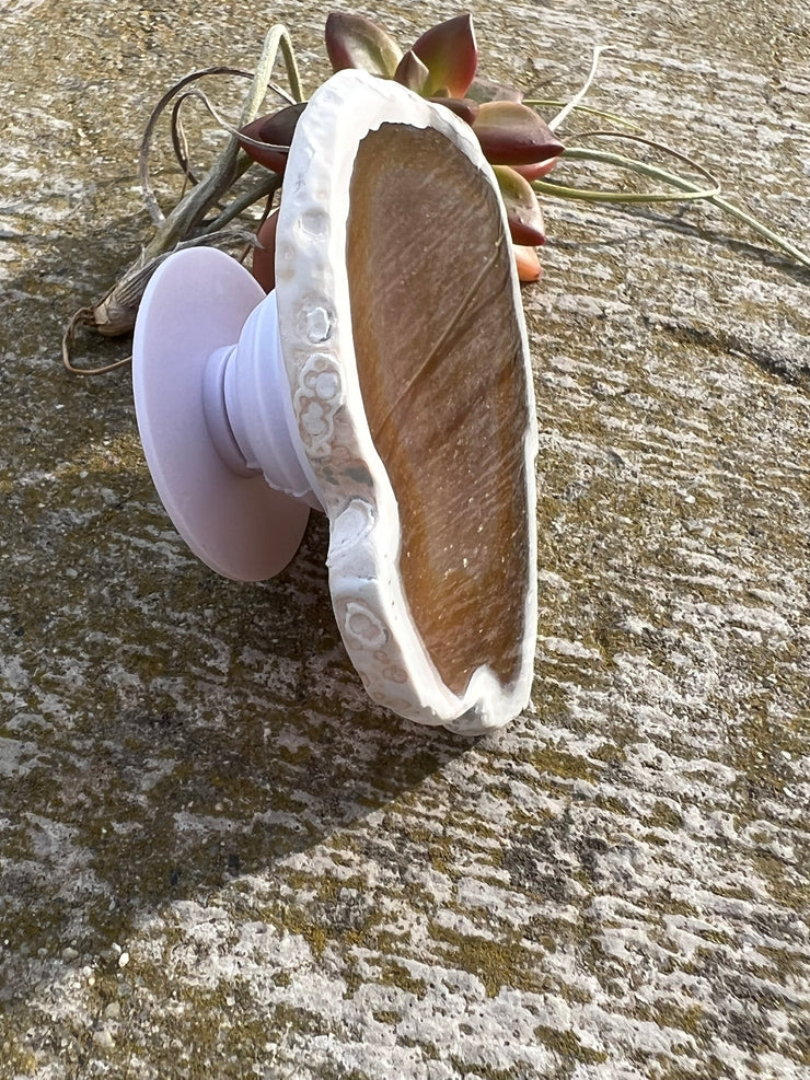 Brown Agate pop socket (popsocket) for use with iphone, androids, ipads, smartphones and other small tecnical devices. Used for easy grip of electronics as well as a beautiful phone accessory. It is an attachment that easily tapes onto the back of the device and pops in and out as needed for use. These agate slices are natural and pure agate stones imported from Brazil of the highest quality with it&