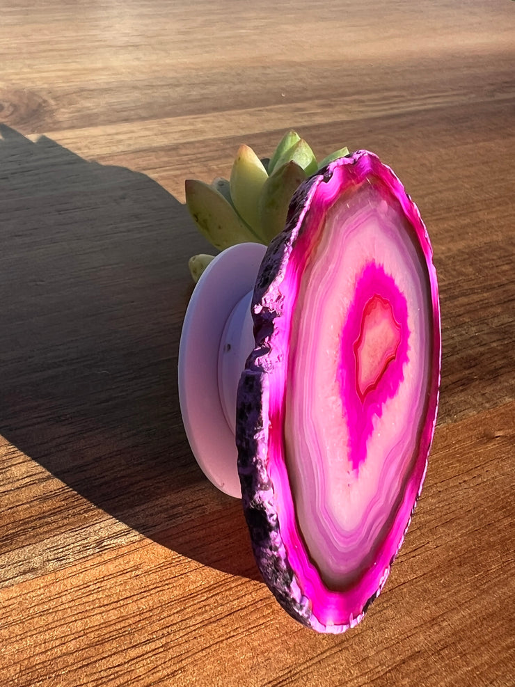 Pink Agate pop socket (popsocket) for use with iphone, androids, ipads, smartphones and other small tecnical devices. Used for easy grip of electronics as well as a beautiful phone accessory. It is an attachment that easily tapes onto the back of the device and pops in and out as needed for use. These agate slices are natural and pure agate stones imported from Brazil of the highest quality with it&