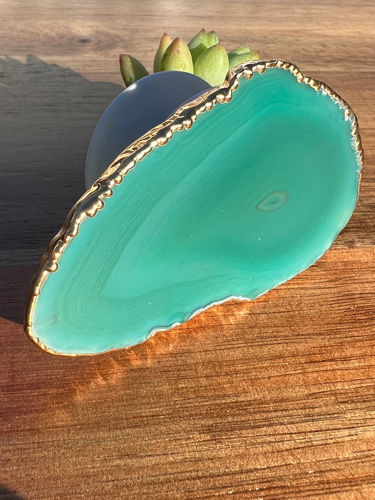 Green Agate pop socket (popsocket) for use with iphone, androids, ipads, smartphones and other small tecnical devices. Used for easy grip of electronics as well as a beautiful phone accessory. It is an attachment that easily tapes onto the back of the device and pops in and out as needed for use. These agate slices are natural and pure agate stones imported from Brazil of the highest quality and beautifylly gold dipped on the rim.