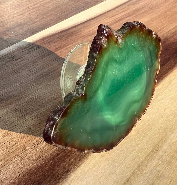 Green Agate pop socket (popsocket) for use with iphone, androids, ipads, smartphones and other small tecnical devices. Used for easy grip of electronics as well as a beautiful phone accessory. It is an attachment that easily tapes onto the back of the device and pops in and out as needed for use. These agate slices are natural and pure agate stones imported from Brazil of the highest quality with it&