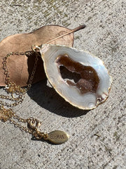 Natural Agate slice druzy necklace pendant, gold rimmed. Varies in hues, size, shape and tones. Comes with durable 14k gold filled chain length 16inches (41cm) and Elemant logo tag in gold attached by the clasp. Beautifully crafted natural agate stones in highest quality imported from Brazil.