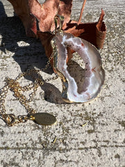 Natural Agate slice druzy necklace pendant, gold rimmed. Varies in hues, size, shape and tones. Comes with durable 14k gold filled chain length 16inches (41cm) and Elemant logo tag in gold attached by the clasp. Beautifully crafted natural agate stones in highest quality imported from Brazil.
