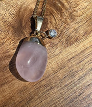 Rose Quartz pendant with small 18k gold and crystal pendant, 16inch (41cm) unique gold chain with Elemant logo emblem attached to the clasp. Rose quartz is the stone of universal love.
