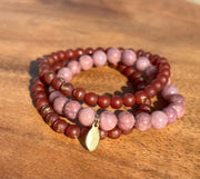 Lightly gold speckled natural Carnelian and Lepidotite bracelet in three stretchy strings and one Elemant gold emblem attached. All three stings come detached from one another for easy wear and comfort.