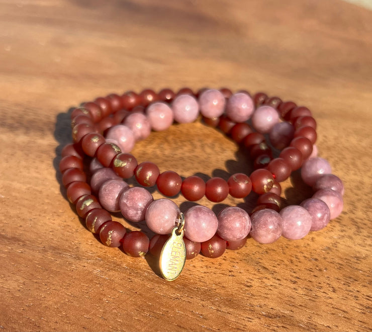 Lightly gold speckled natural Carnelian and Lepidotite bracelet in three stretchy strings and one Elemant gold emblem attached. All three stings come detached from one another for easy wear and comfort.