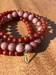 Lightly gold speckled natural Carnelian and Lepidotite bracelet in three stretchy strings and one Elemant gold emblem attached.  All three stings come detached from one another for easy wear and comfort.