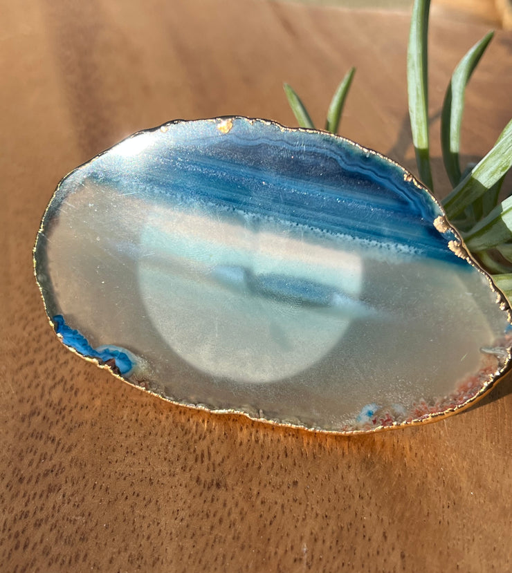 Blue Agate pop socket (popsocket) for use with iphone, androids, ipads, smartphones, and other small tecnical devices. Used for easy grip of electronics as well as a beautiful phone accessory. It is an attachment that easily tapes onto the back of the device and pops in and out as needed for use. These agate slices are natural and pure agate stones imported from Brazil of the highest quality and beautifylly gold dipped on the rim.