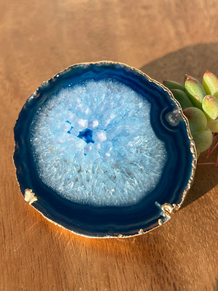 Blue Agate pop socket (popsocket) for use with iphone, androids, ipads, smartphones, and other small tecnical devices. Used for easy grip of electronics as well as a beautiful phone accessory. It is an attachment that easily tapes onto the back of the device and pops in and out as needed for use. These agate slices are natural and pure agate stones imported from Brazil of the highest quality and beautifylly gold dipped on the rim.