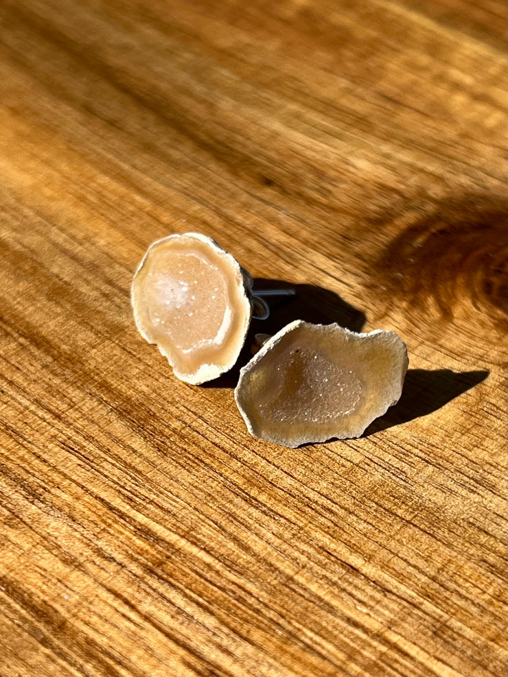 Druzy earrings with visible crystalized formations in naturally shaped variations of size, shape and color and 925 sterling silver stud backing