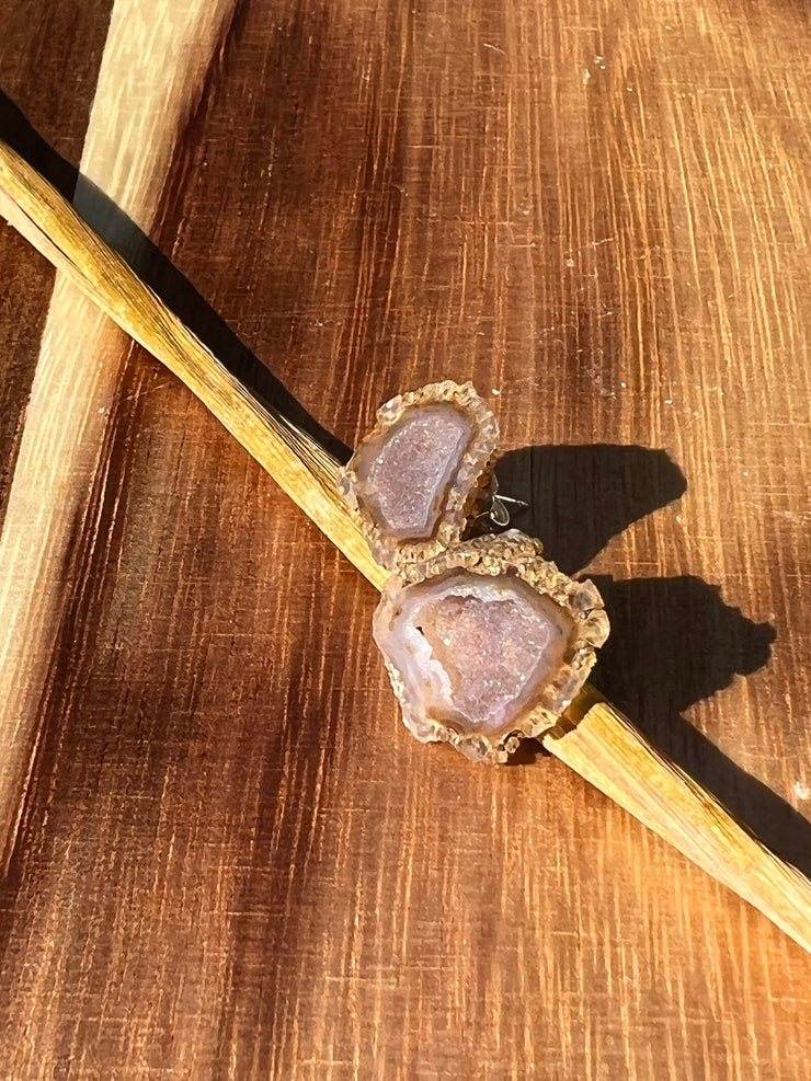 Druzy earrings with visible crystalized formations in naturally shaped variations of size, shape and color and 925 sterling silver stud backing.