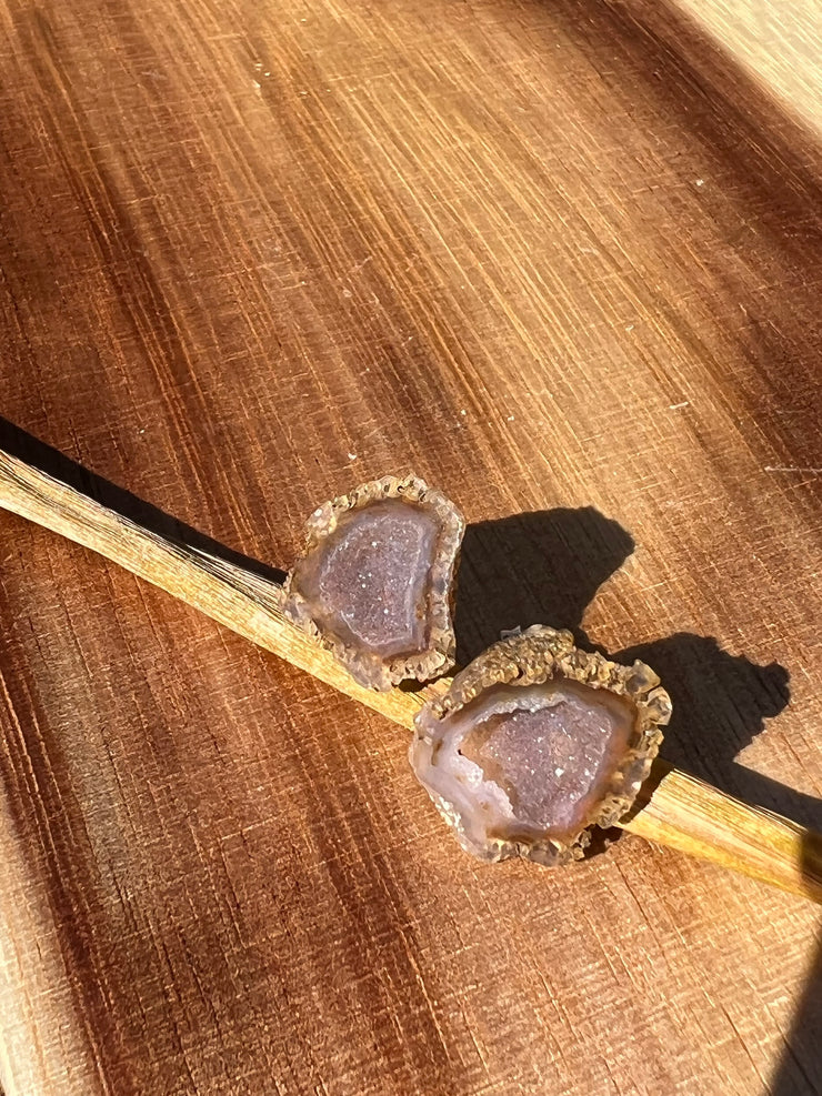 Druzy earrings with visible crystalized formations in naturally shaped variations of size, shape and color and 925 sterling silver stud backing.
