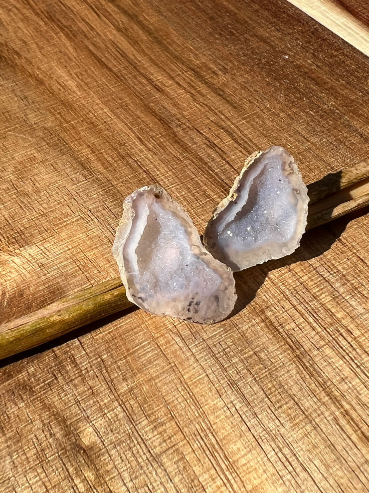 Druzy earrings with visible crystalized formations in naturally shaped variations of size, shape and color and 925 sterling silver stud backing.