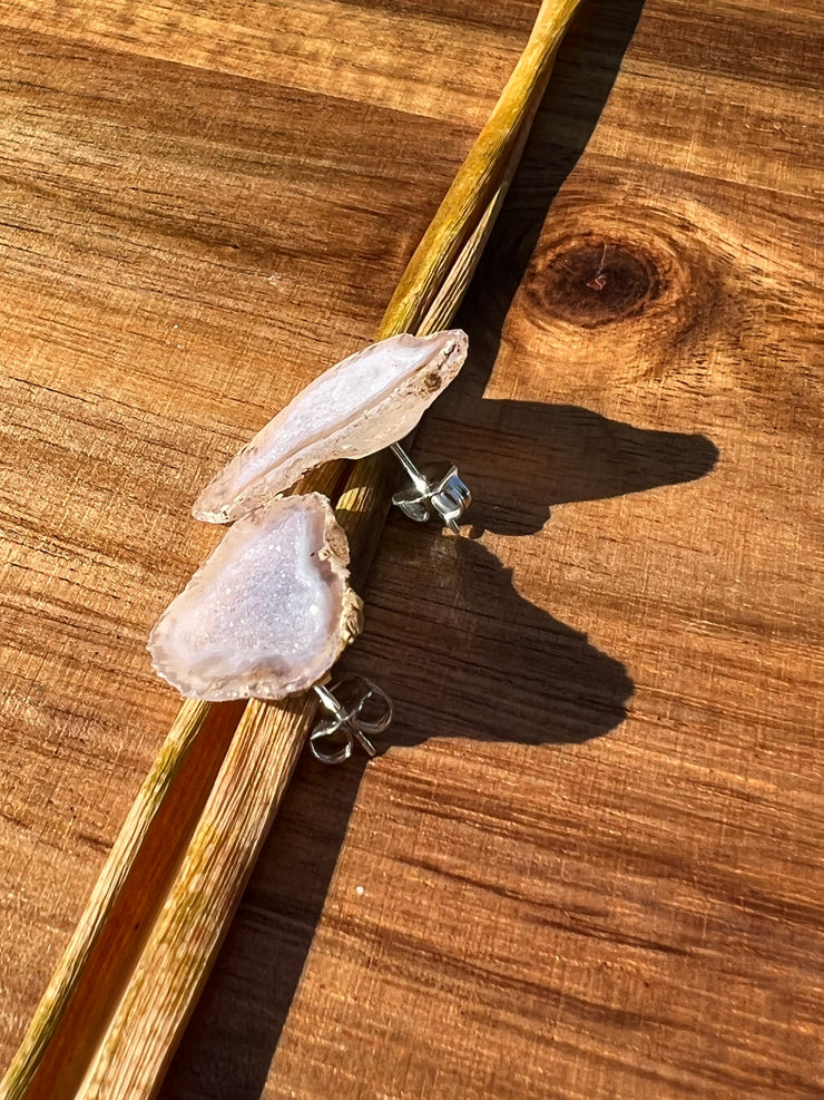 Druzy earrings with visible crystalized formations in naturally shaped variations of size, shape and color and 925 sterling silver stud backing.