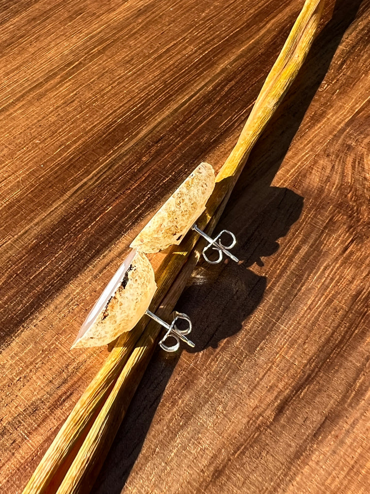Druzy earrings with visible crystalized formations in naturally shaped variations of size, shape and color and 925 sterling silver stud backing.