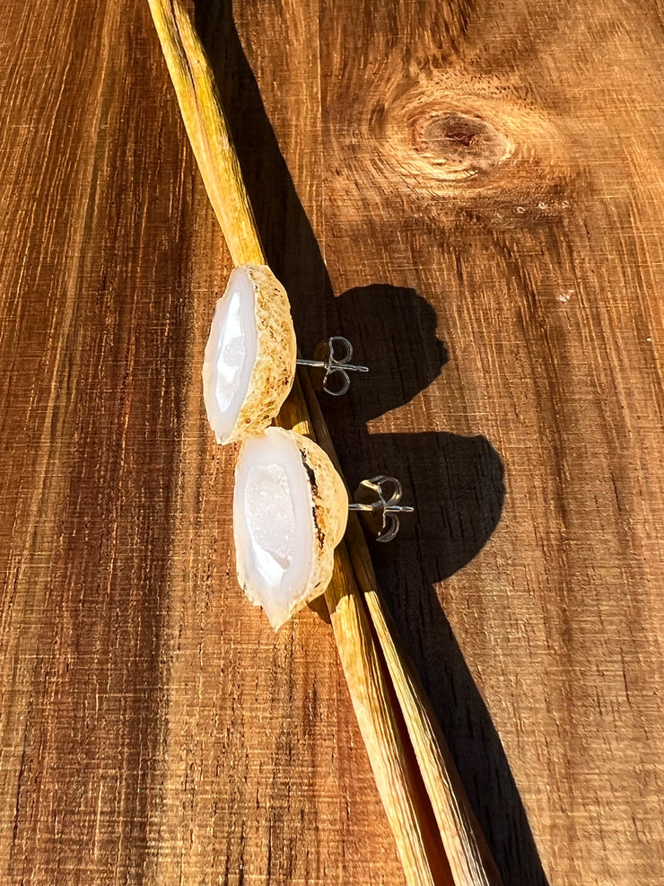 Druzy earrings with visible crystalized formations in naturally shaped variations of size, shape and color and 925 sterling silver stud backing.