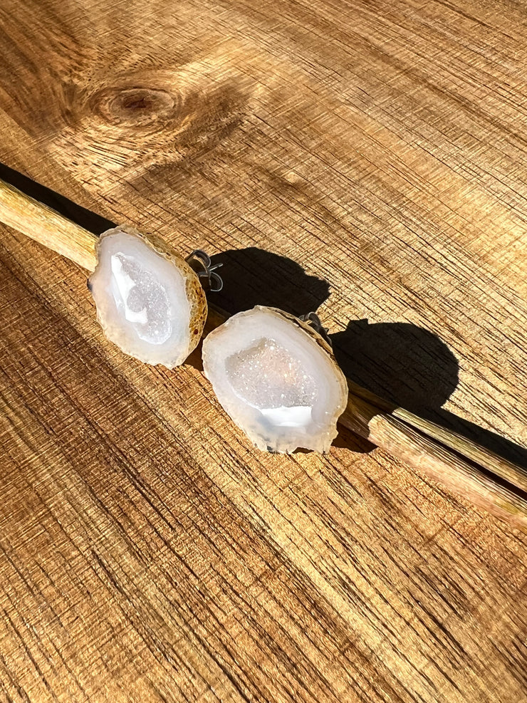 Druzy earrings with visible crystalized formations in naturally shaped variations of size, shape and color and 925 sterling silver stud backing.