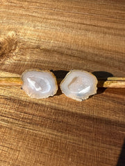 Druzy earrings with visible crystalized formations in naturally shaped variations of size, shape and color and 925 sterling silver stud backing. 