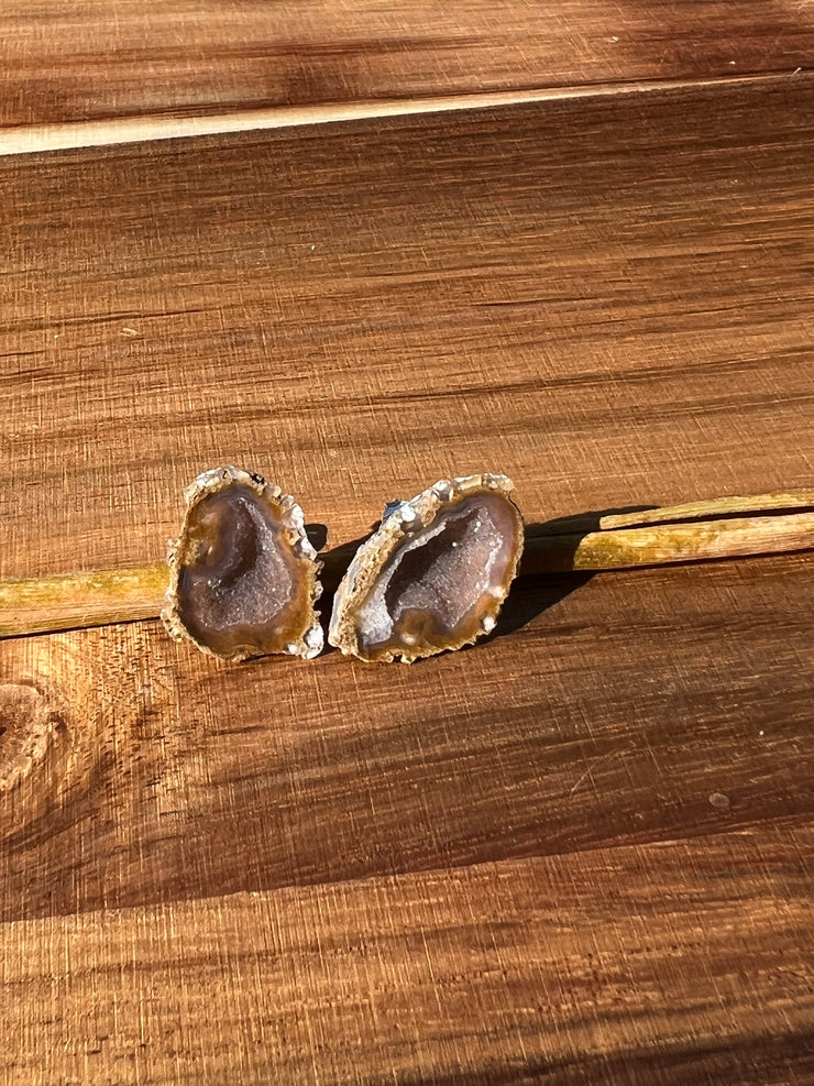 Druzy earrings with visible crystalized formations in naturally shaped variations of size, shape and color and 925 sterling silver stud backing.