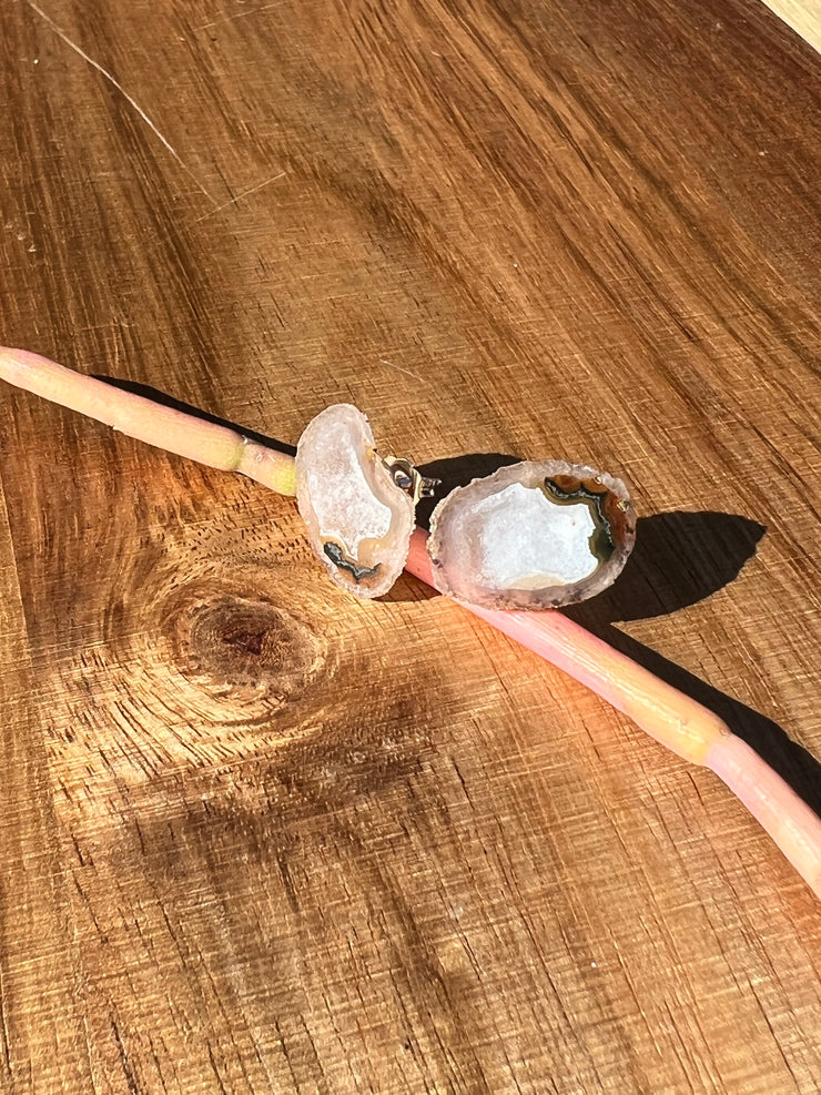 Druzy earrings with visible crystalized formations in naturally shaped variations of size, shape and color and 925 sterling silver stud backing.