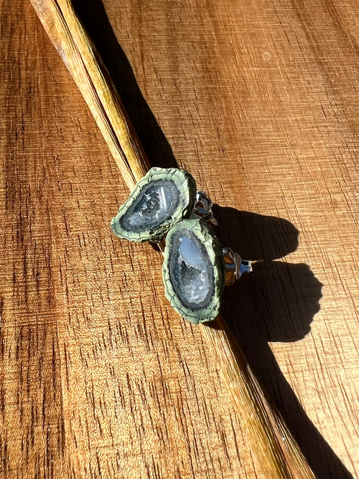 Druzy earrings with visible crystalized formations in naturally shaped variations of size, shape and color and 925 sterling silver stud backing.