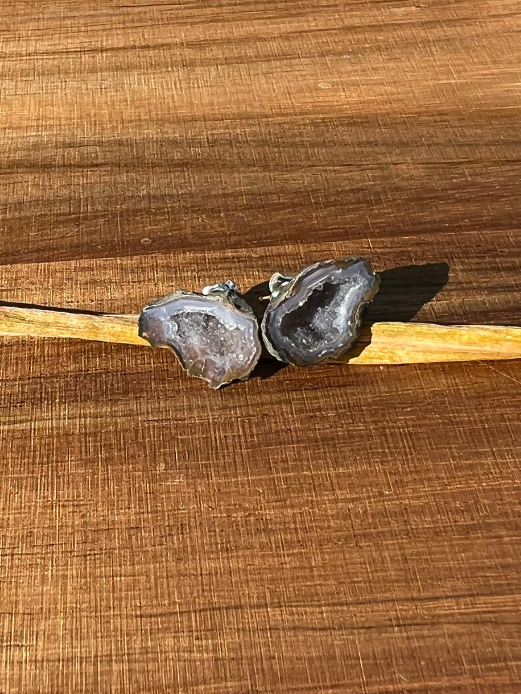 Druzy earrings with visible crystalized formations in naturally shaped variations of size, shape and color and 925 sterling silver stud backing.