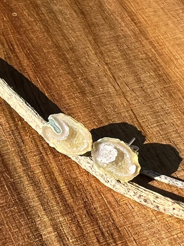 Druzy earrings with visible crystalized formations in naturally shaped variations of size, shape and color and 925 sterling silver stud backing.