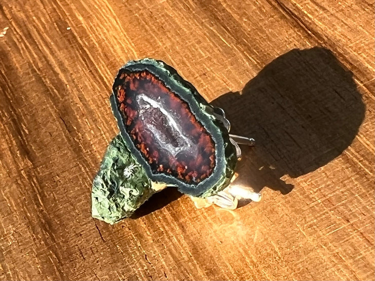 Druzy earrings with visible crystalized formations in naturally shaped variations of size, shape and color and 925 sterling silver stud backing. Picture included for size reference.