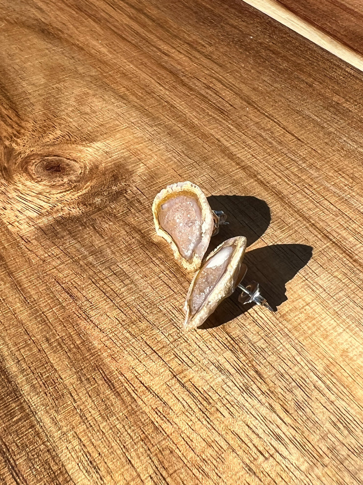 Druzy earrings with visible crystalized formations in naturally shaped variations of size, shape and color and 925 sterling silver stud backing.