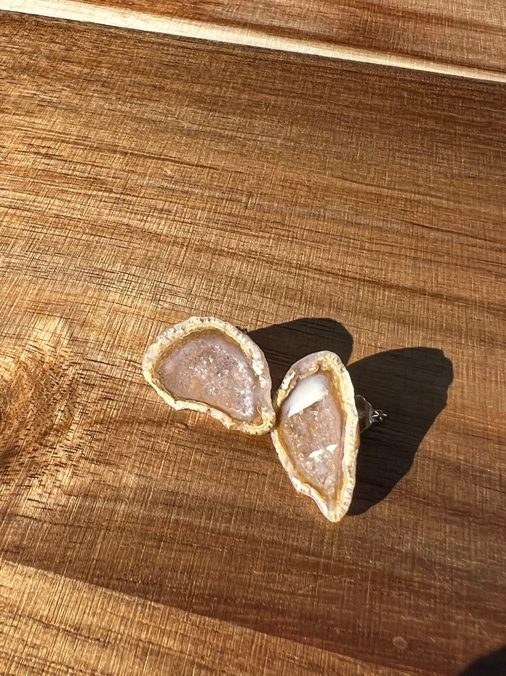 Druzy earrings with visible crystalized formations in naturally shaped variations of size, shape and color and 925 sterling silver stud backing.