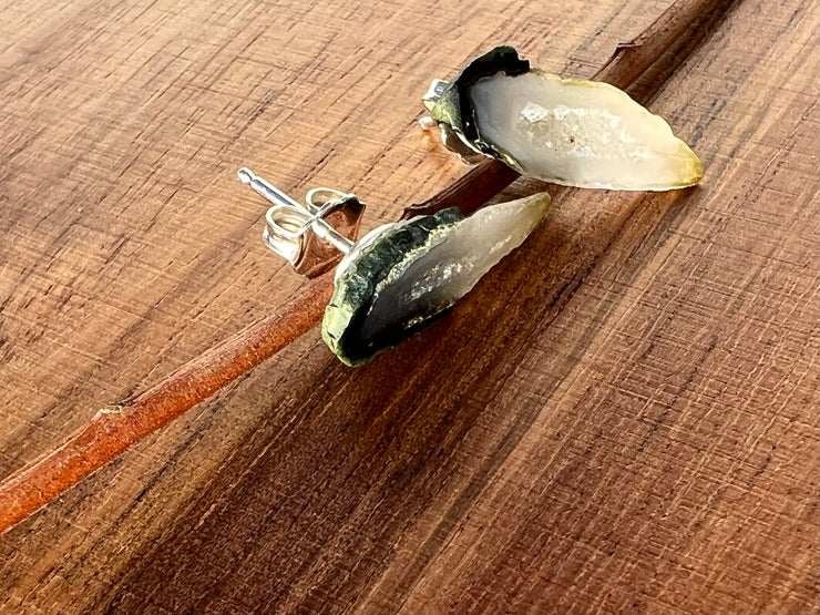 Druzy earrings with visible crystalized formations in naturally shaped variations of size, shape and color and 925 sterling silver stud backing.