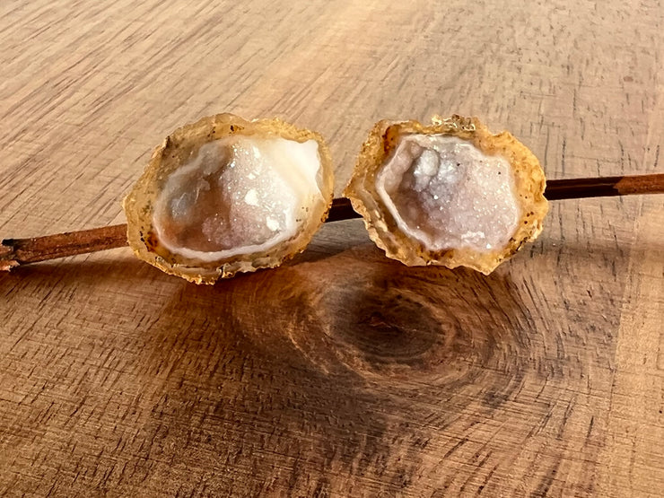 Druzy earrings with visible crystalized formations in naturally shaped variations of size, shape and color and 925 sterling silver stud backing.