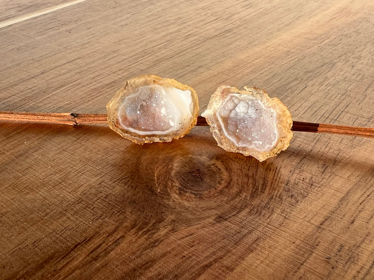 Druzy earrings with visible crystalized formations in naturally shaped variations of size, shape and color and 925 sterling silver stud backing.
