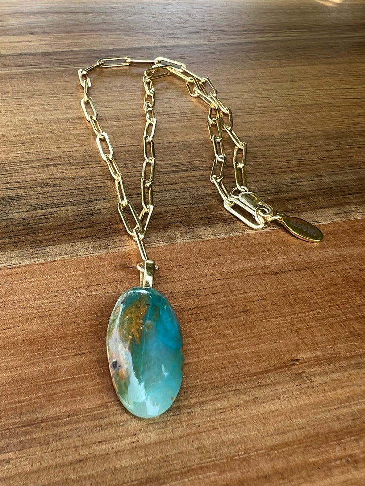 Opal pendant with 17.5 inch (44.5cm) oval chain linked 14k gold filled chain and a gold Elemant logo emblem attached at the clasp.  Opal is the stone of abundance, fortune, luck, health and wealth.