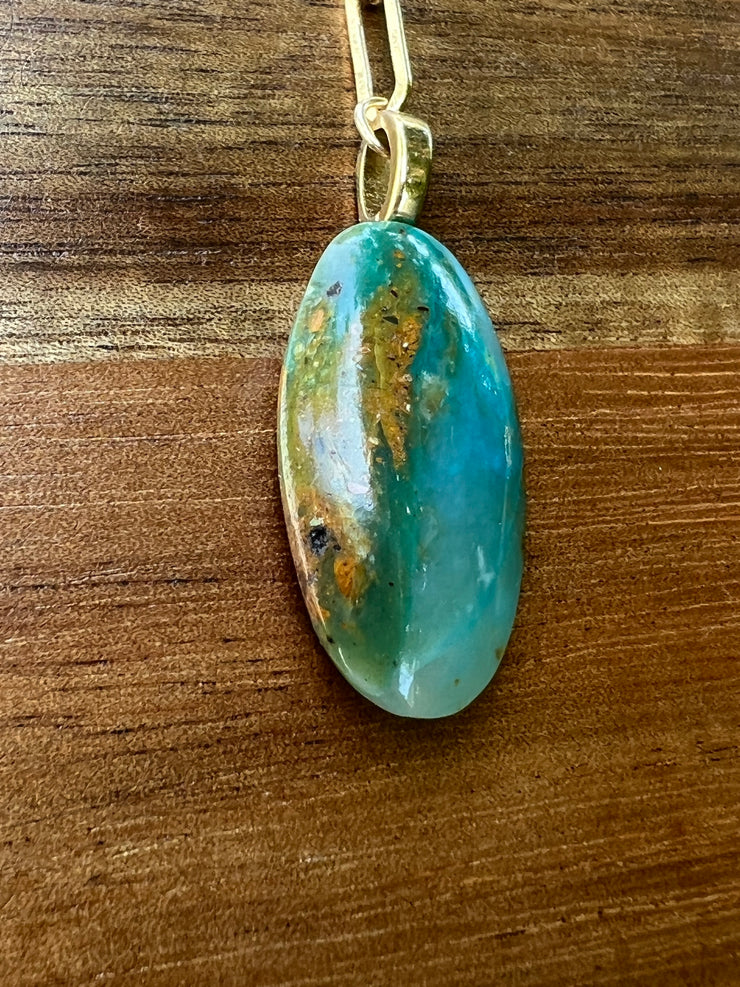 Opal pendant with 17.5 inch (44.5cm) oval chain linked 14k gold filled chain and a gold Elemant logo emblem attached at the clasp. Opal is the stone of abundance, fortune, luck, health and wealth.