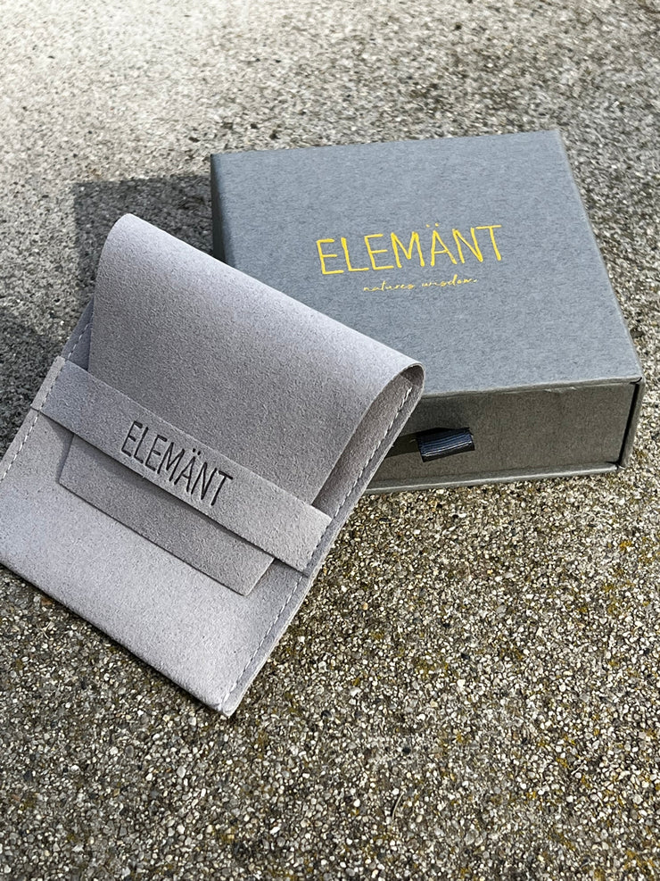 Each necklace arrives in a gray 4*4*1.5in (10*10*3.5cm) beautiful high quality and carefully designed pull out box with shiny embossed logo on front and instagram name on back. Inside is a 3.5*3.5in (9*9cm) lighter gray seude pouch with debossed logo on the band laying on top of a black soft cushion. Our packaging is of the highest quality and comes ready for gift giving.