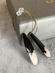 Palm Root stone on hoop earrings. Each stone has a unique natural patten and varies in color. These stones are about 2.5cm to 3.5 cm long and are very light, which makes them easy to wear. Every set of earrings are paired with hoops to match, please see main page for specifics.